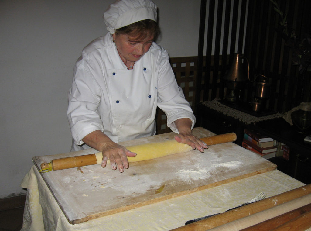 Chef Mirella rolling out the dough for the strangozzi.